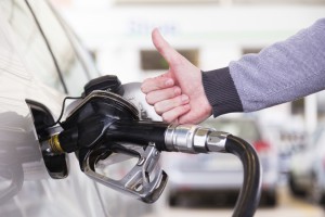 Petrol being pumped into a motor vehicle car.